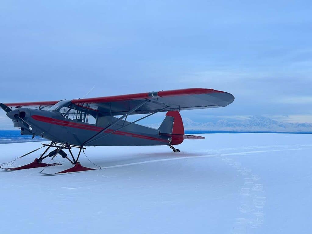 piper super cub landing on skis in alaska